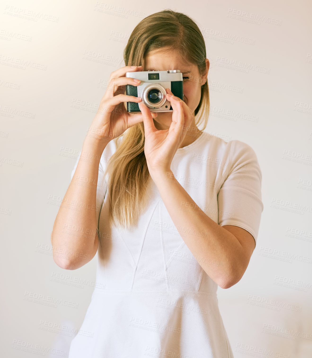 Buy stock photo Camera, woman and photographer in living room for hobby, capture memory or photoshoot. Lens, creativity and female student with vintage equipment for journalism, media or artistic expression in home