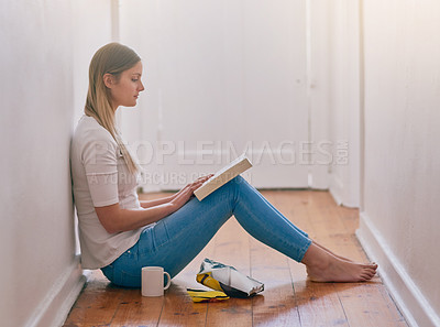 Buy stock photo Woman, home and read book on floor in the passage for knowledge, information and fantasy. Female person, break and relax on day with novel for literature, research and study with chilling and enjoy