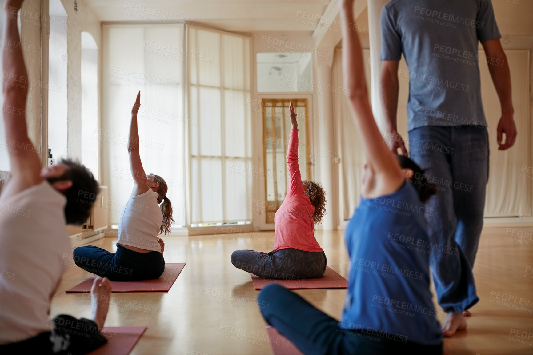 Buy stock photo Shot of a group of people attending a yoga class