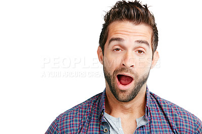 Buy stock photo Studio shot of a young man yawning against a white background