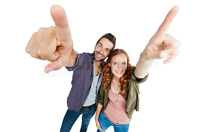 Buy stock photo Shot of a couple pointing against a white background