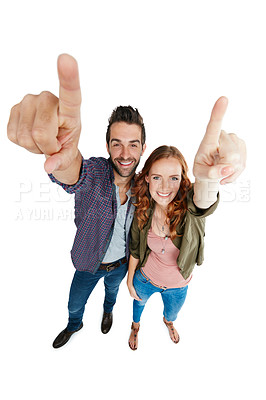Buy stock photo Shot of a couple pointing against a white background