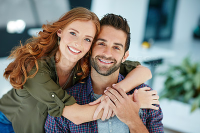 Buy stock photo Portrait of an affectionate young couple embracing each other