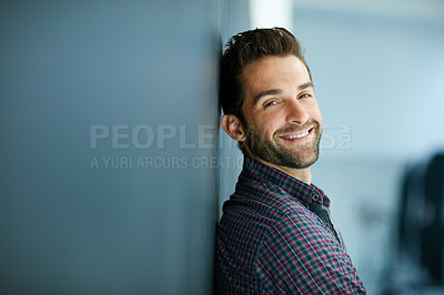 Buy stock photo Portrait of a confident young man leaning against a blackboard