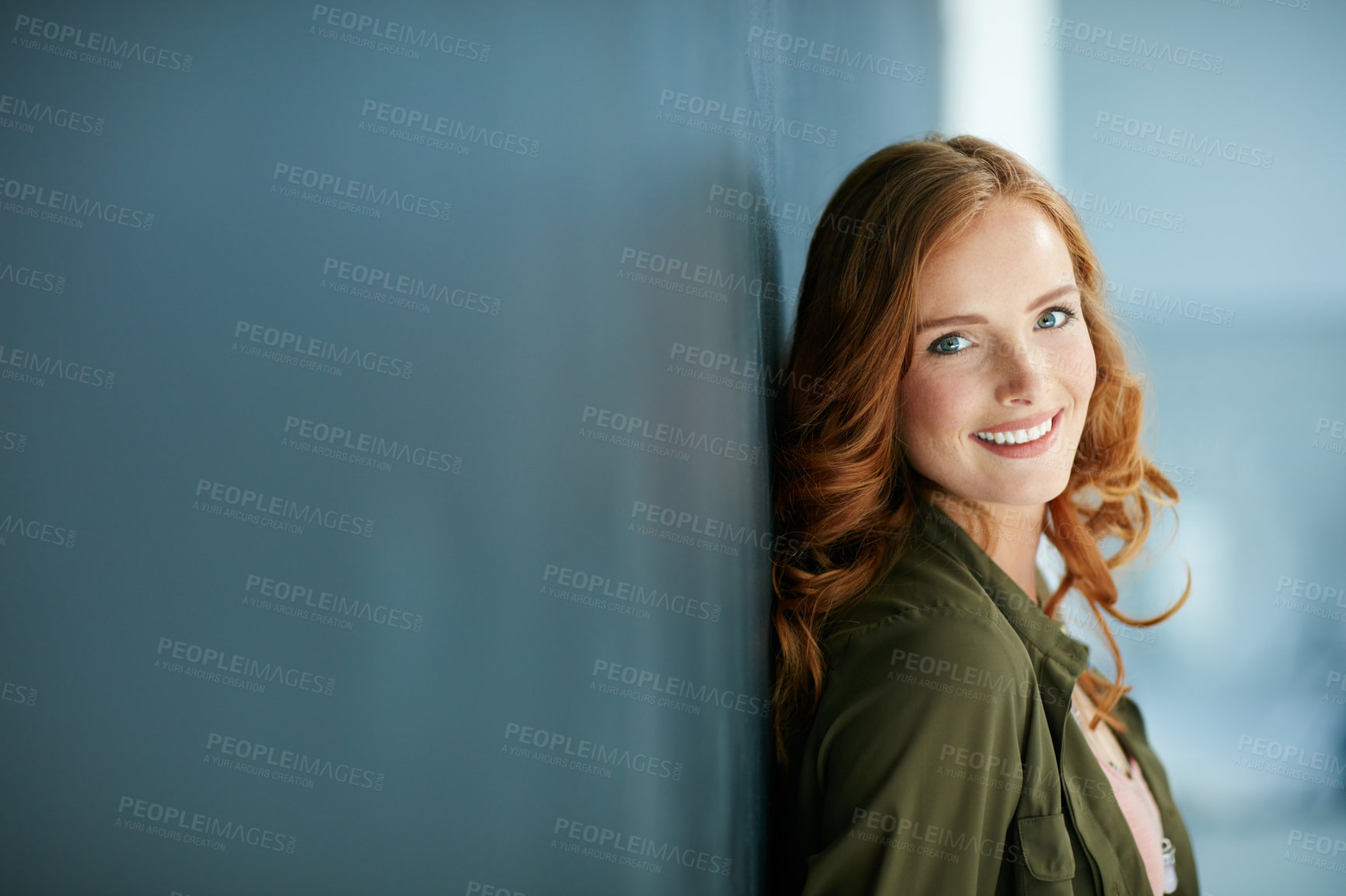 Buy stock photo Portrait of a confident young woman leaning against a blackboard