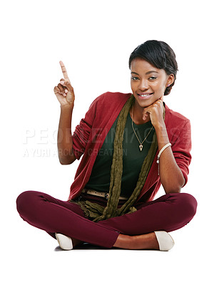 Buy stock photo African woman, happy portrait and pointing finger, relax sitting isolated in white background for advertising mockup. Black woman, smile and point for marketing, product placement or idea vision 