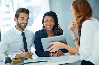 Buy stock photo Cropped shot of a young couple meeting with their advisor in an office