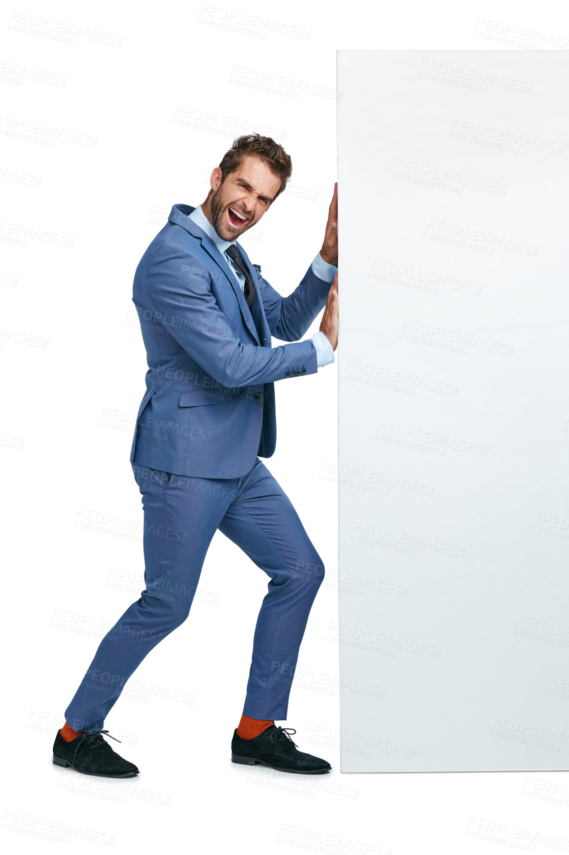 Buy stock photo Studio shot of a handsome businessman pushing a wall against a white background