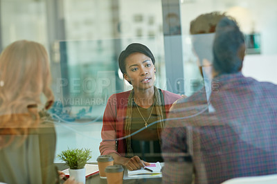 Buy stock photo Shot of a team of creative businesspeople having a meeting in their office
