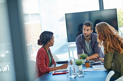 Buy stock photo Shot of a team of creative businesspeople having a meeting in their office