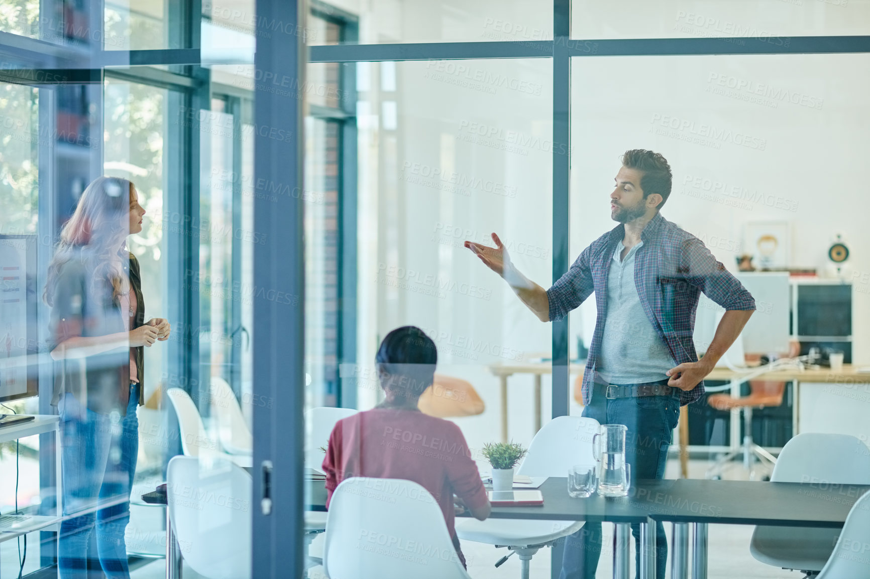 Buy stock photo Shot of a team of creative businesspeople having a meeting in their office