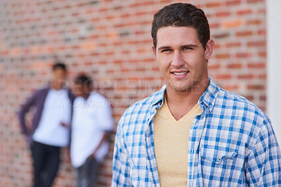 Buy stock photo Portrait of a university student on campus with his friends in the background