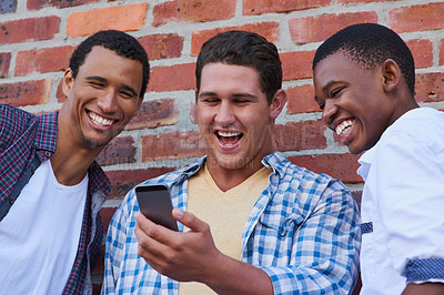 Buy stock photo Cropped shot of a group of university students hanging out between class