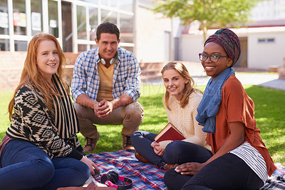 Buy stock photo Shot of a group of young friends having their study session outside