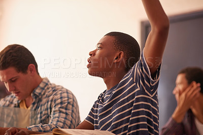 Buy stock photo Cropped shot of a university student raising his hand in class