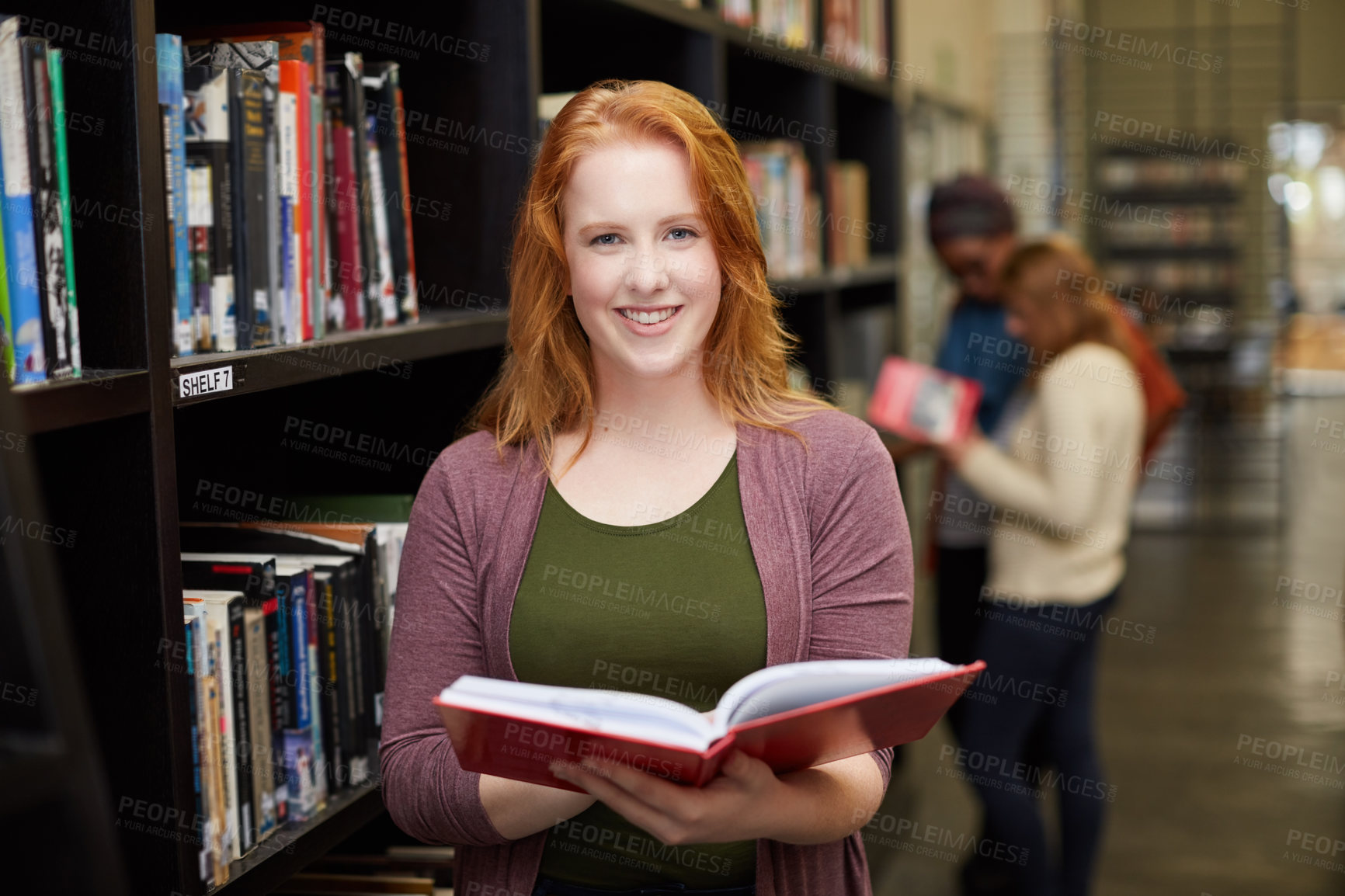 Buy stock photo Portrait of a university student working in the campus library
