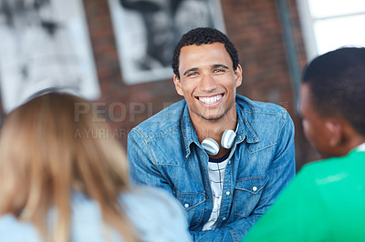Buy stock photo Portrait of a young university student sitting in his classroom during a group project