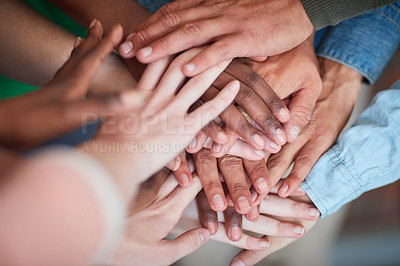 Buy stock photo High angle shot of university students' hands in a huddle