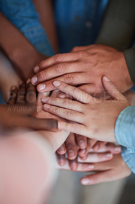 Buy stock photo High angle shot of university students' hands in a huddle