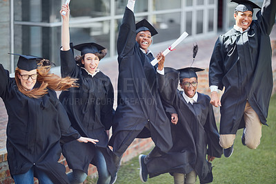 Buy stock photo High angle shot of a happy group of students jumping in celebration on graduation day