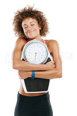 Buy stock photo Studio shot of a fit young woman embracing a scale against a white background