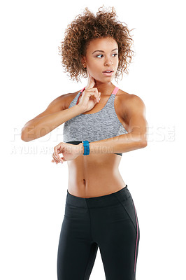 Buy stock photo Studio shot of a fit young woman checking her pulse