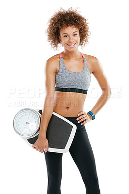 Buy stock photo Studio portrait of a fit young woman holding a scale against a white background
