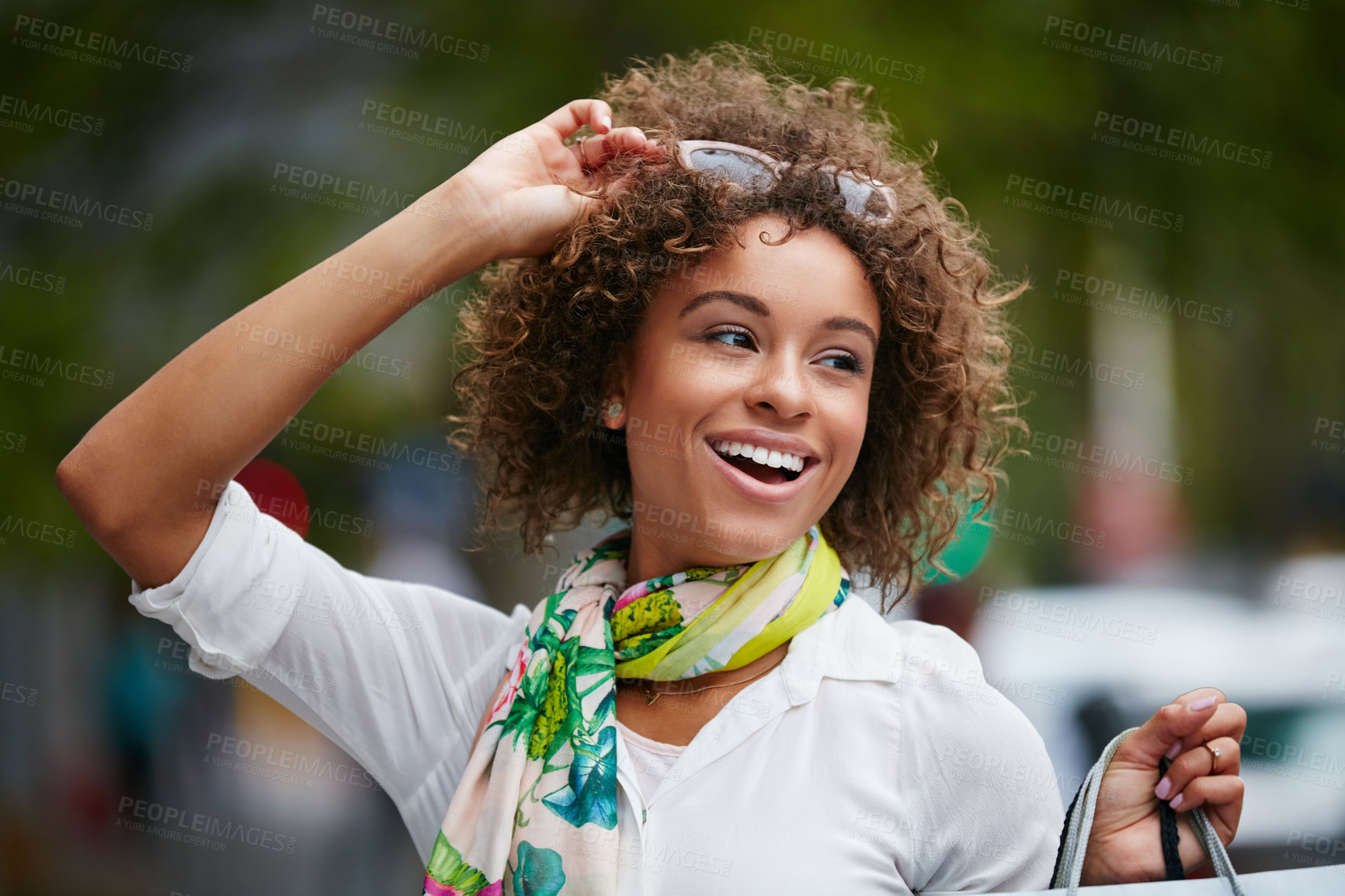 Buy stock photo Shot of an attractive young woman on a shopping spree in the city