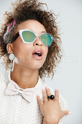 Buy stock photo Woman, fashion and stylish sunglasses for summer against a grey studio background. Fashionable female model in cool trendy, curly hair or funky beauty style with eyewear on a gray background
