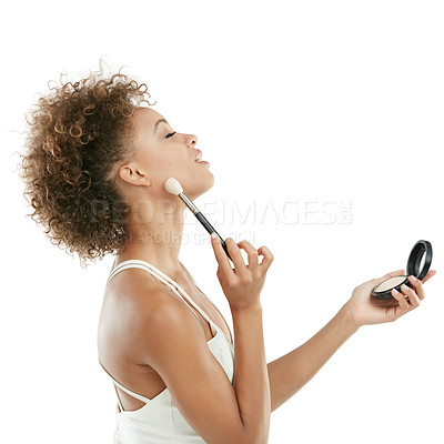 Buy stock photo Studio shot of an attractive young woman applying makeup to her face against a white background