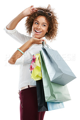 Buy stock photo Studio shot of an attractive young woman holding shopping bags against a white background