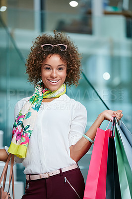 Buy stock photo Portrait of an attractive young woman on a shopping spree at the mall