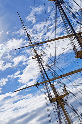 Buy stock photo Blue sky, rope and travel with mast of ship outdoor in nature from below for Danish heritage. Adventure, engineering and history with flagpole on sail boat for journey, holiday or vacation at sea