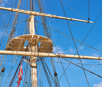 Buy stock photo Blue sky, history and travel with mast of sail boat outdoor in nature from below for Danish heritage. Adventure, engineering and rope with flagpole on ship for journey, holiday or vacation at sea