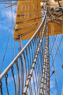 Buy stock photo Blue sky, historical and travel with mast of ship outdoor in nature from below for Danish heritage. Culture, engineering and rope with flagpole on sail boat for journey, holiday or vacation at sea