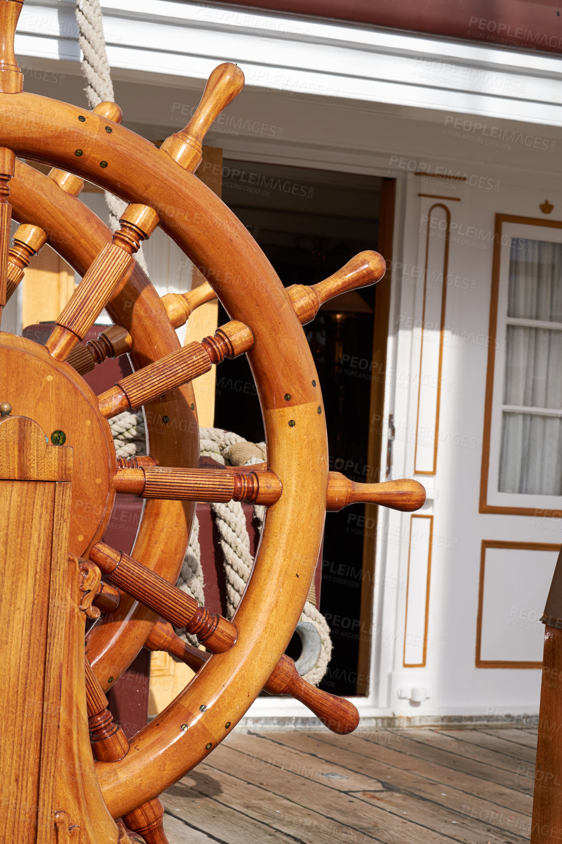 Buy stock photo Wood, boat and vintage steering wheel for sailing, travel and navigation or control direction. Ship, helm and old transport for cruise, history and voyage for journey on deck for vacation or tourism