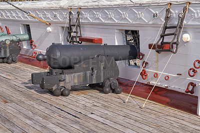 Buy stock photo Museum, boat and cannon on deck for travel, sightseeing and landmark vessel in Denmark. Ship, history and architecture with war gun for tourist attraction, exhibition and transportation on ocean