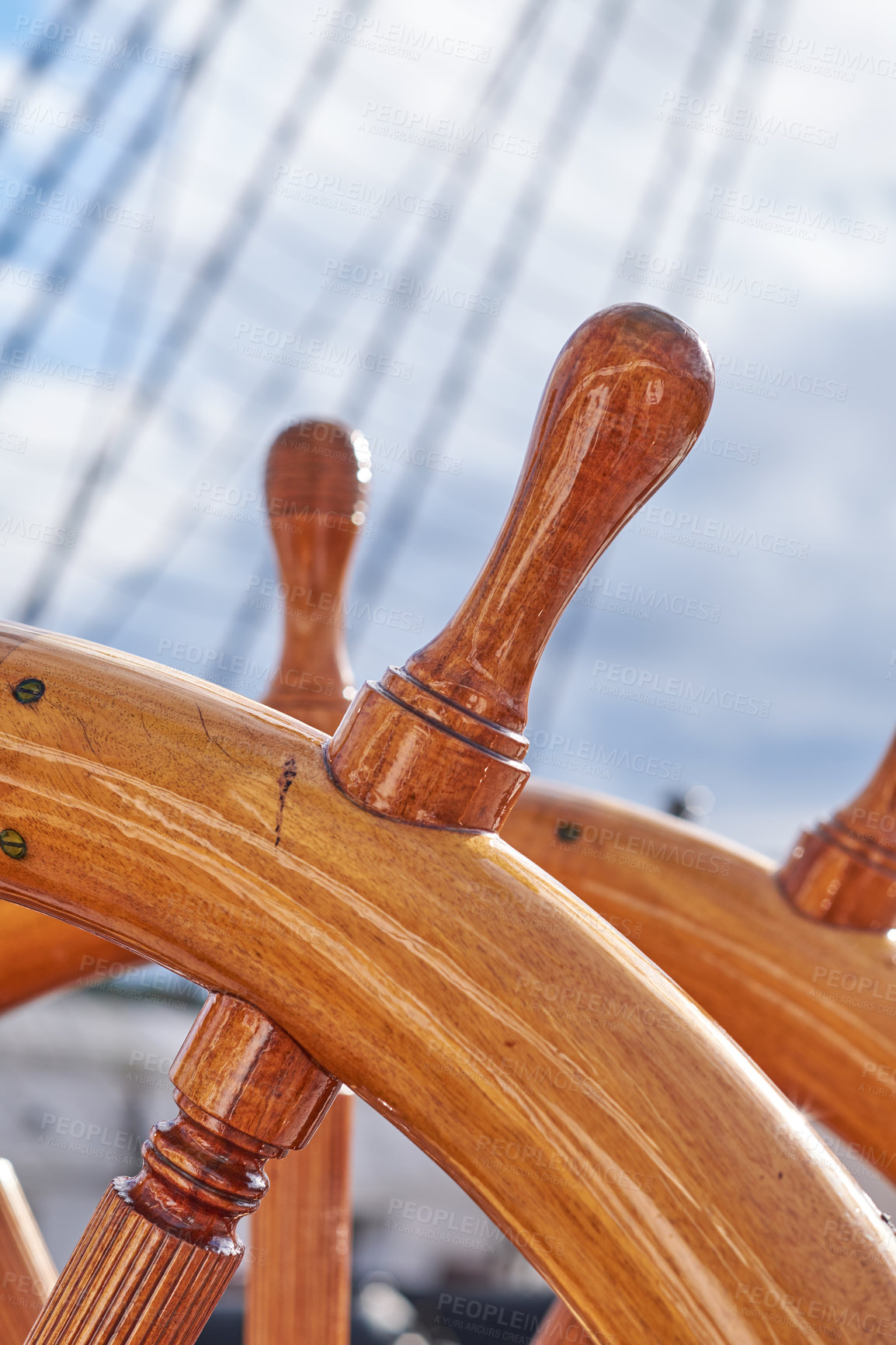 Buy stock photo Outdoor, ship and wood steering wheel at deck for sailing, transportation and travel. Harbor, marine and sailboat in closeup for luxury, adventure and trip or journey with cruising and navigation