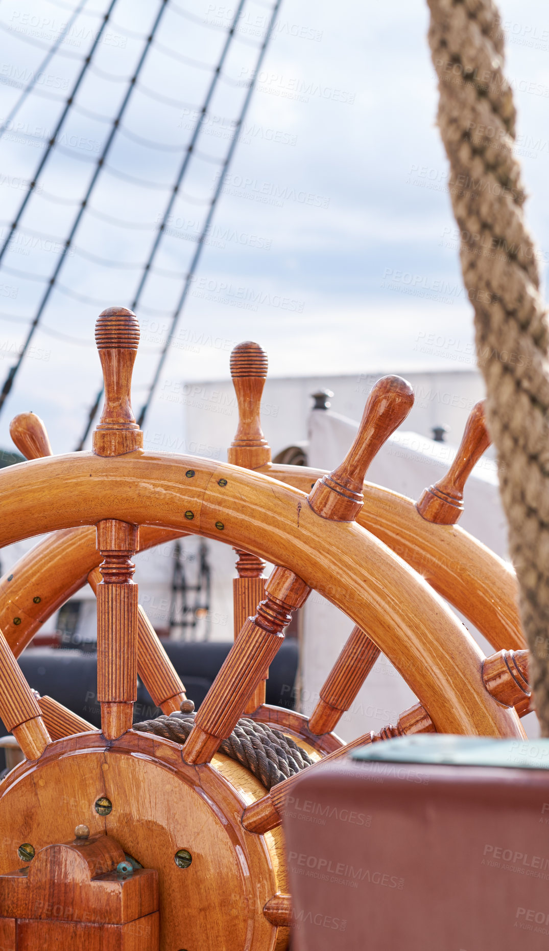 Buy stock photo Marine, ship and wood steering wheel at harbor for sailing, transportation and travel. Ocean, outdoor and sailboat in closeup for luxury, adventure and trip or journey with cruise and navigation