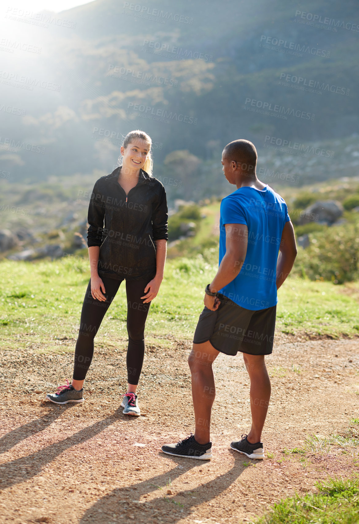 Buy stock photo Shot of two athletes chatting before their run