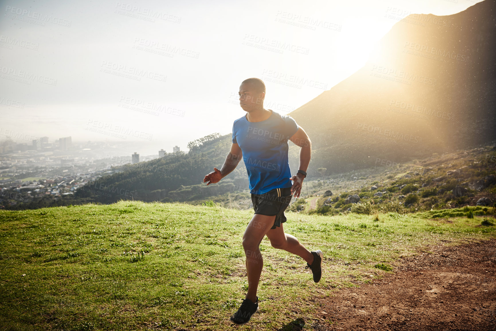 Buy stock photo Man, fitness and running with sunshine on mountain for workout, exercise or outdoor training in nature. Active, male person or young runner with sun in sprint or race for marathon, health or wellness