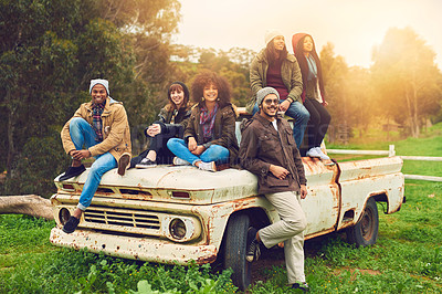 Buy stock photo Portrait of a group of friends posed around an old truck in a field