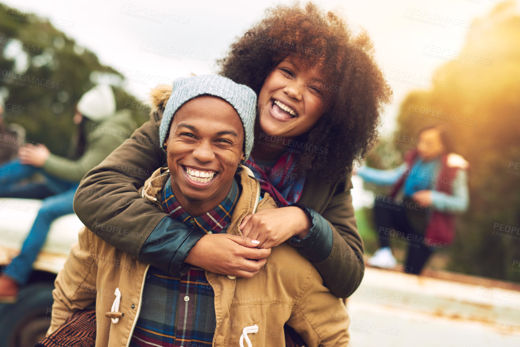 Buy stock photo Smile, couple portrait and piggyback with love, bonding and fun on holiday with winter date. Happy, african man and woman with vacation with park, care and freedom in nature, forest or woods travel