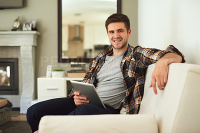 Buy stock photo Portrait, relax and tablet with man on sofa in living room of home for app, browsing or social media. Internet, smile and technology with happy person in apartment for comfort or weekend time off