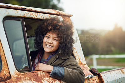 Buy stock photo Portrait of a happy young woman sitting in a rusty old truck