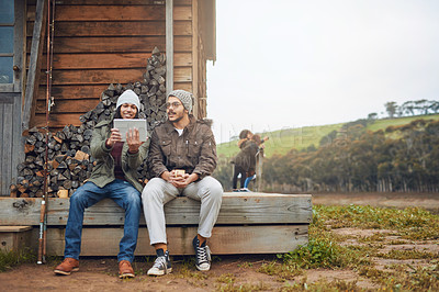 Buy stock photo Happy man, friends and camping with tablet on patio in nature for connectivity, signal or browsing. Male people, relax or campers with technology for entertainment at holiday house in countryside