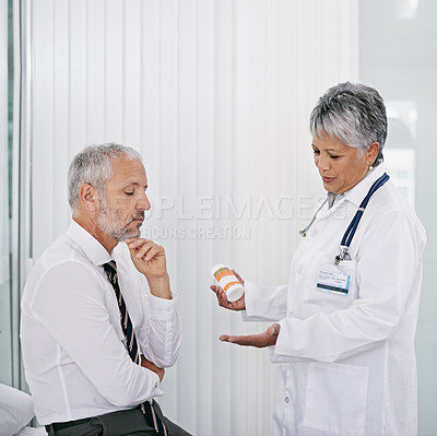 Buy stock photo Hospital, consulting and doctor with patient and pills, medication and prescription in clinic. Healthcare, talk and health worker with senior man for wellness, supplements and medicine for treatment
