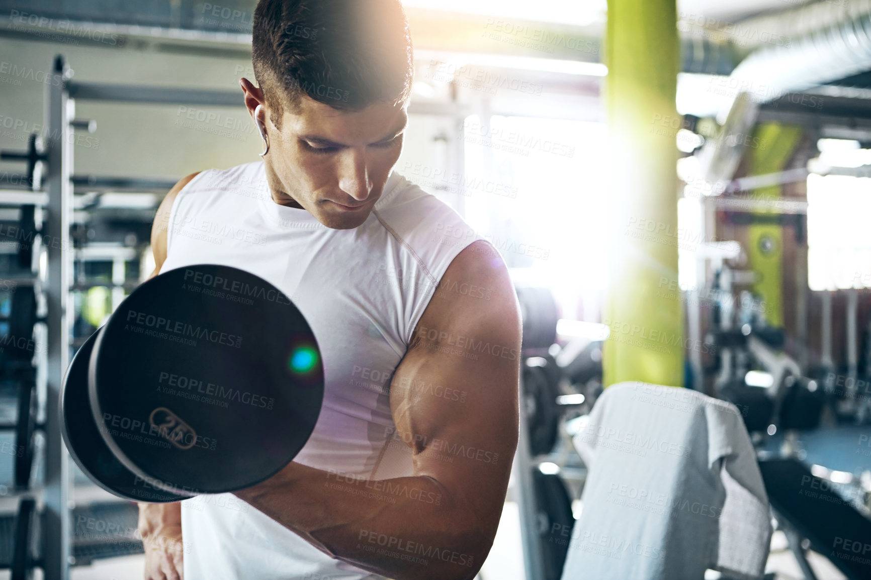 Buy stock photo Shot of a man doing weight training at the gym