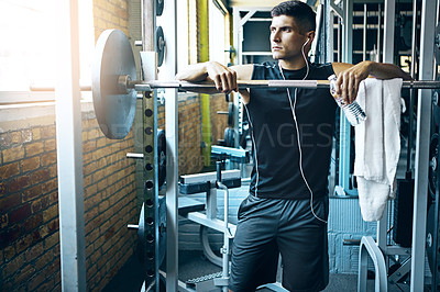 Buy stock photo Shot of a man doing weight training at the gym