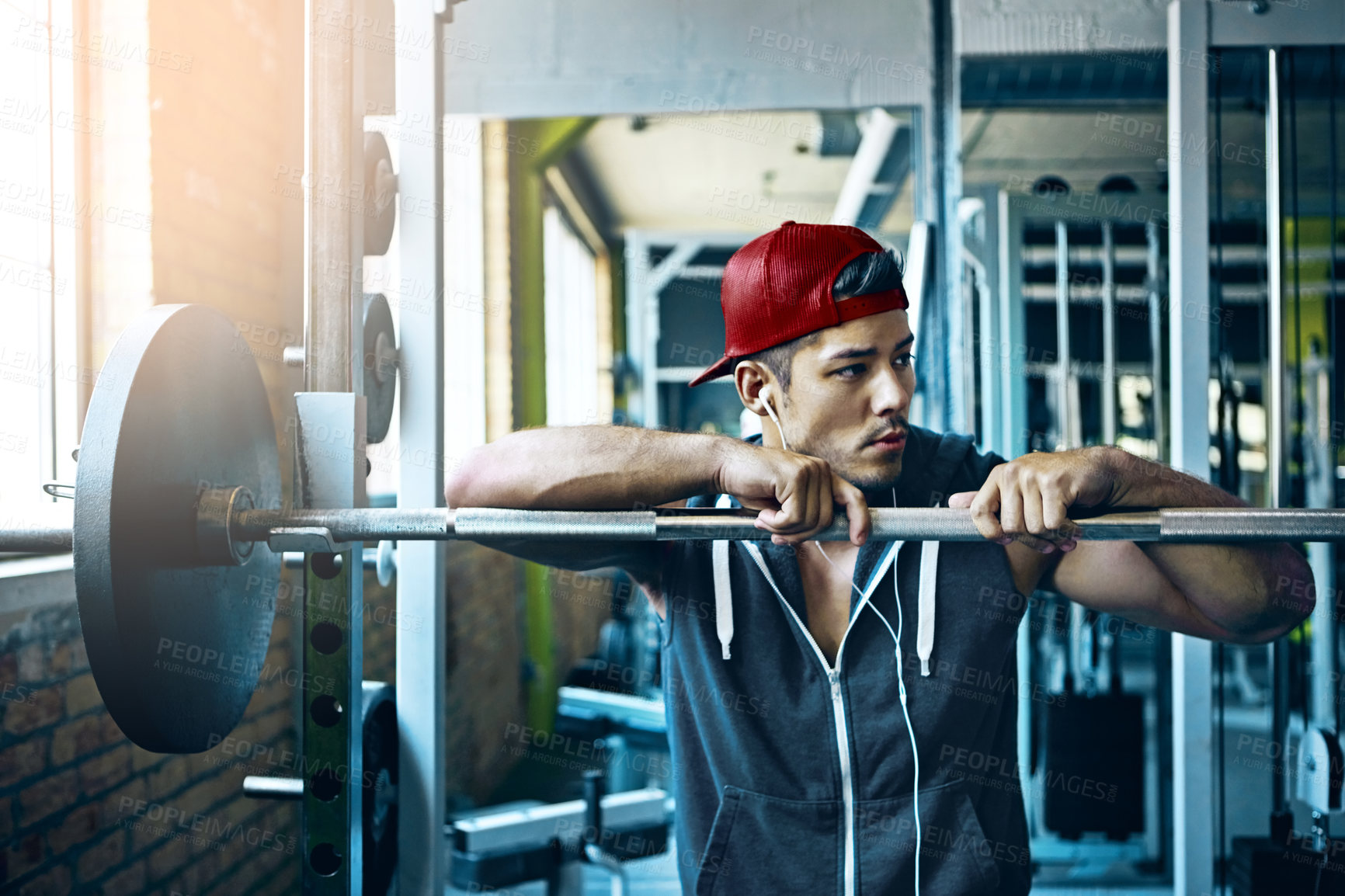 Buy stock photo Shot of a man doing weight training at the gym